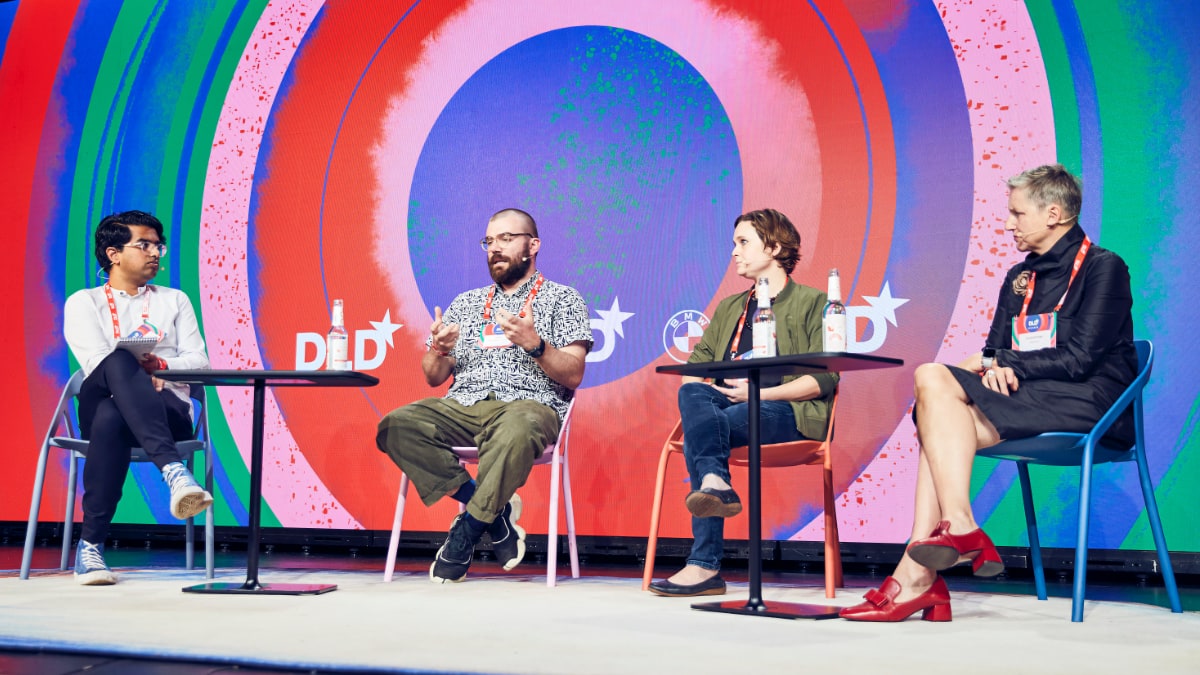 Designing Circularity panel discussion at DLD Circular 2023 in Munich: left to right, moderator Amit Katwala (WIRED UK) in conversation with Joe Iles (Ellen MacArthur Foundation) Jessie Storey (Steelcase), Daniela Bohlinger (BMW Group)
