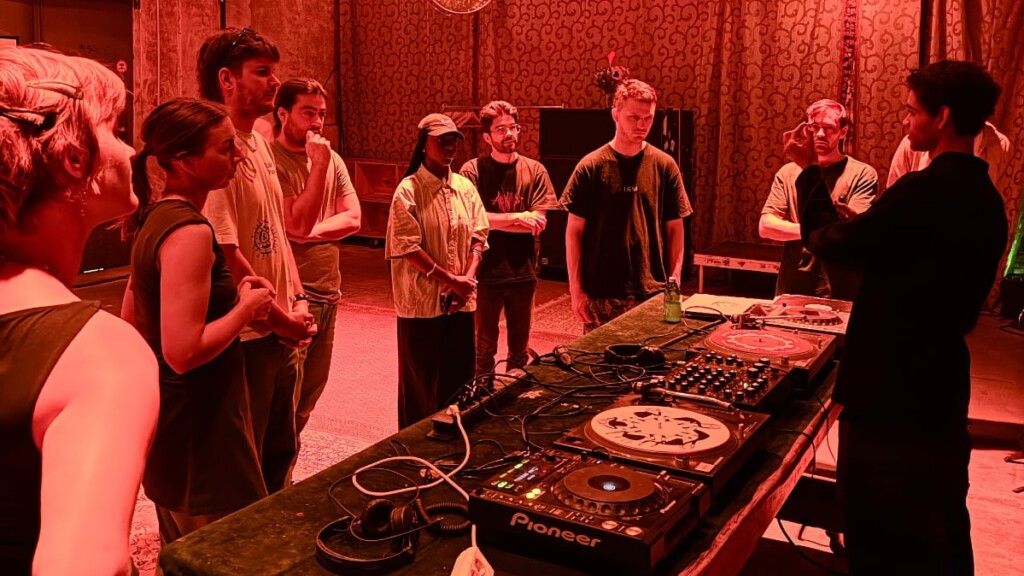 Attendees of the DLD Music School learning how to spin vinyl records like a professional DJ.